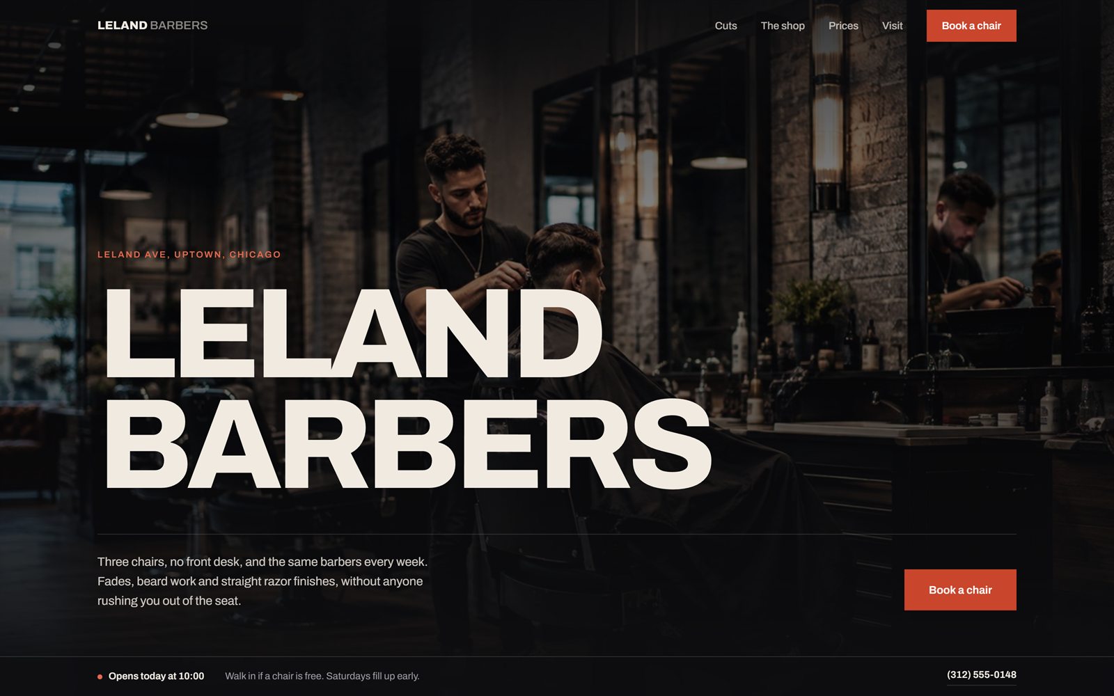 Leland Barbers homepage: the shop name set very large in bone over a dark photo of a barber mid cut.